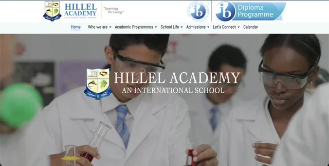 Hillel Academy website homepage featuring students in a science laboratory